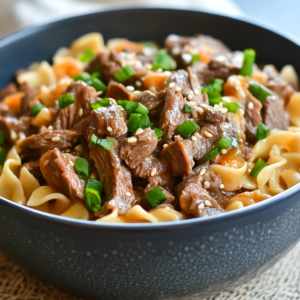 Slow Cooker Beef and Noodles with tender beef chunks and soft noodles in a savory broth.